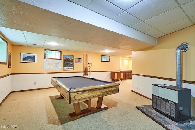 5074 Tall Timbers Dr, Richfield, OH 44286 - playroom featuring a paneled ceiling, carpet flooring, baseboards, billiards, and a wood stove