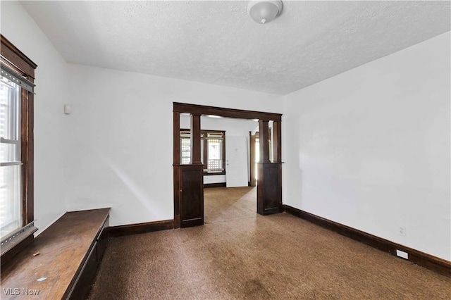 851 Paxton Rd, Cleveland, OH 44108 - unfurnished room with a textured ceiling and baseboards