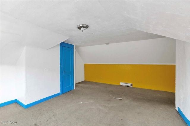 851 Paxton Rd, Cleveland, OH 44108 - additional living space featuring vaulted ceiling, carpet flooring, and a baseboard heating unit