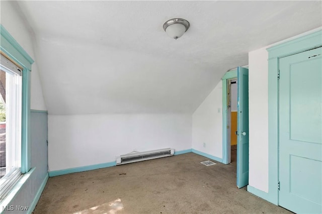 851 Paxton Rd, Cleveland, OH 44108 - additional living space featuring a baseboard radiator, baseboards, vaulted ceiling, and carpet