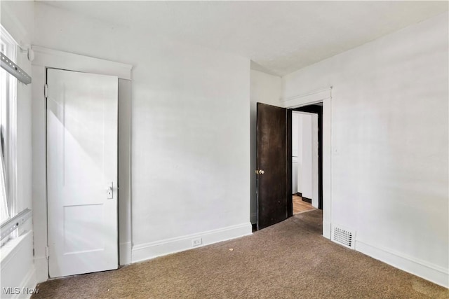 851 Paxton Rd, Cleveland, OH 44108 - unfurnished bedroom with carpet flooring and baseboards