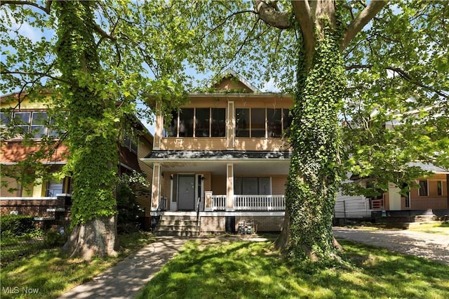 851 Paxton Rd, Cleveland, OH 44108 - view of front of property featuring covered porch and a front yard