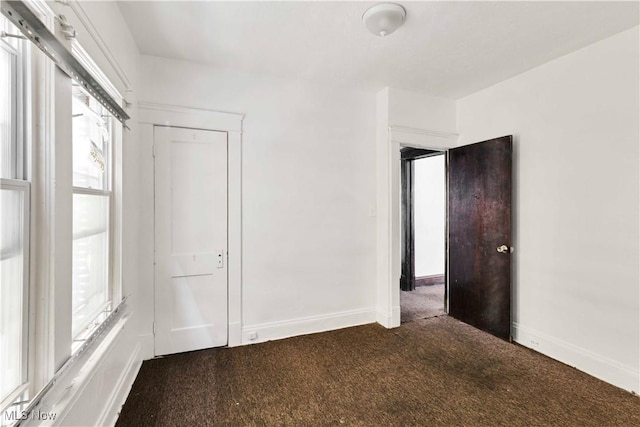 851 Paxton Rd, Cleveland, OH 44108 - unfurnished room featuring carpet flooring, plenty of natural light, and baseboards