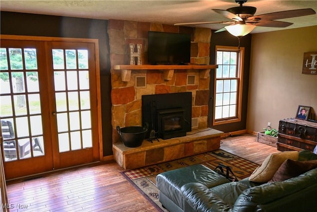 5399 N Elyria Rd, West Salem, OH 44287 - living room with french doors, wood-type flooring, a ceiling fan, and baseboards