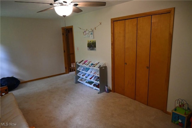 5399 N Elyria Rd, West Salem, OH 44287 - bedroom with carpet, a closet, ceiling fan, and baseboards