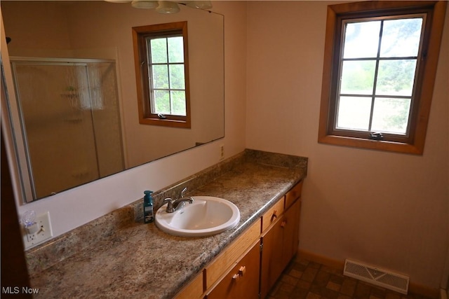 5399 N Elyria Rd, West Salem, OH 44287 - bathroom with vanity, a shower stall, and baseboards
