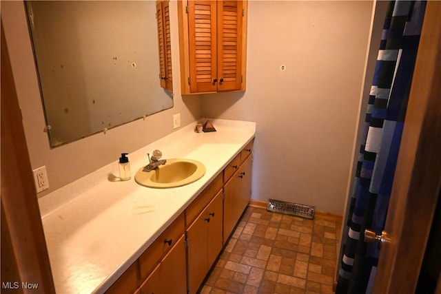 5399 N Elyria Rd, West Salem, OH 44287 - bathroom with vanity and brick patterned floors