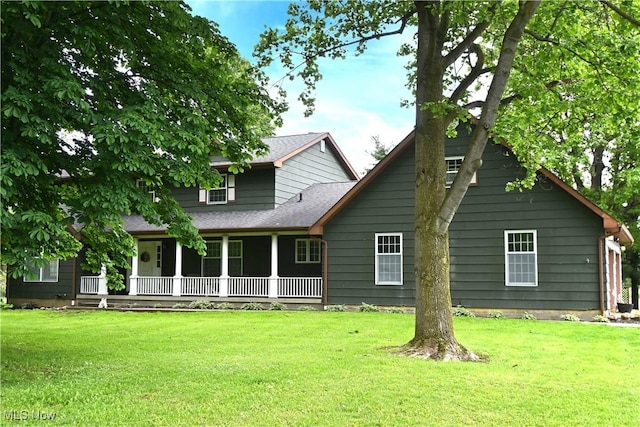 5399 N Elyria Rd, West Salem, OH 44287 - back of property featuring a yard, covered porch, and roof with shingles