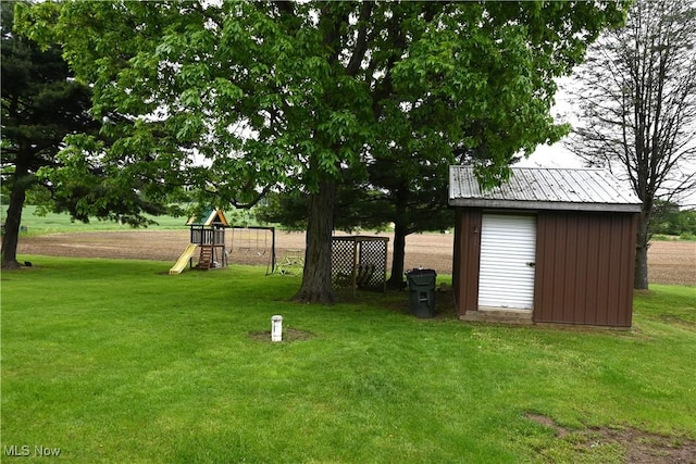 5399 N Elyria Rd, West Salem, OH 44287 - view of green lawn with a playground