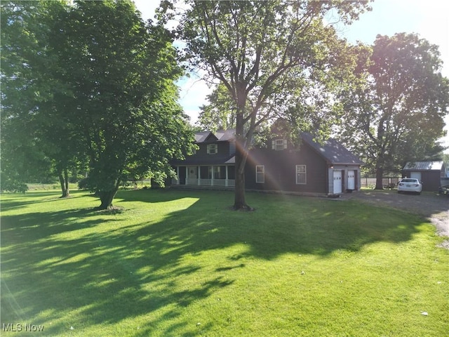 5399 N Elyria Rd, West Salem, OH 44287 - cape cod-style house featuring a front lawn and driveway
