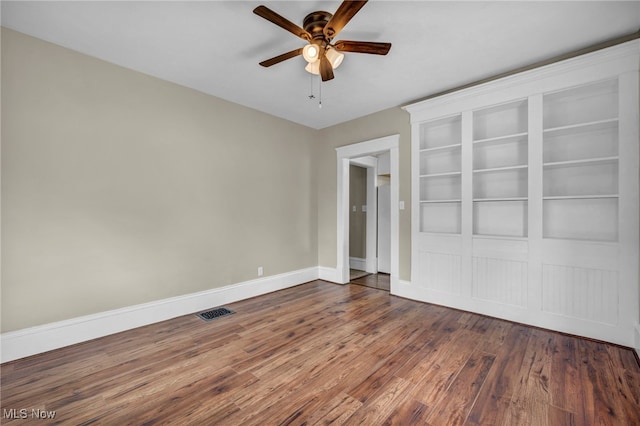 6567 S Pricetown Rd, Berlin Center, OH 44401 - unfurnished bedroom featuring wood finished floors, baseboards, and ceiling fan
