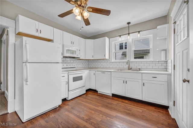 6567 S Pricetown Rd, Berlin Center, OH 44401 - kitchen featuring white appliances, a sink, a ceiling fan, white cabinetry, and backsplash