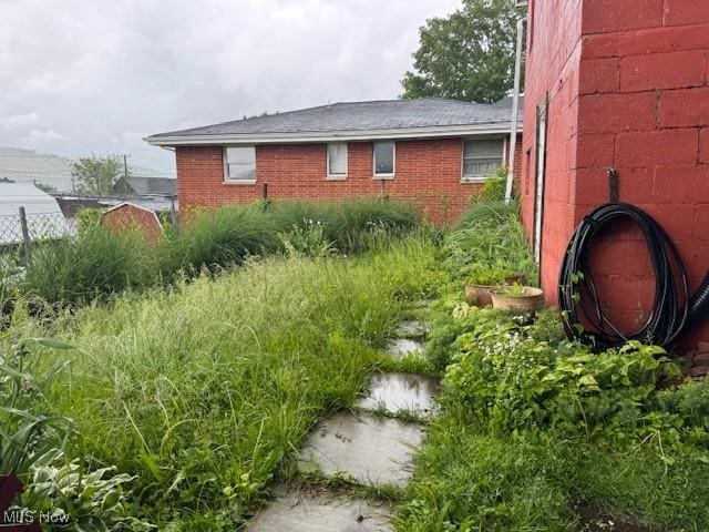 801 High St, Wellsburg, WV 26070 - view of side of home featuring brick siding