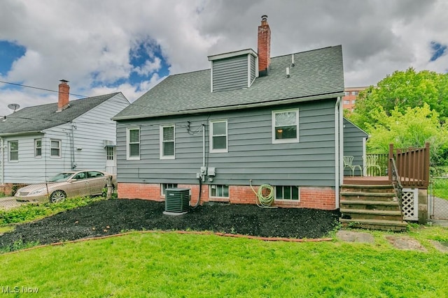 1620 S Taylor Rd, Cleveland Heights, OH 44118 - back of house featuring a wooden deck, central AC unit, a lawn, a chimney, and roof with shingles