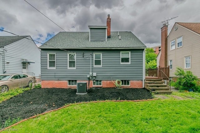 1620 S Taylor Rd, Cleveland Heights, OH 44118 - back of house featuring a yard, central air condition unit, a chimney, and a shingled roof