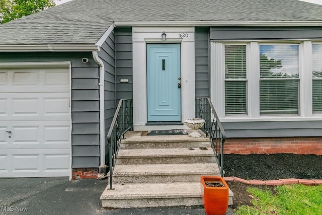 1620 S Taylor Rd, Cleveland Heights, OH 44118 - property entrance with a shingled roof and a garage