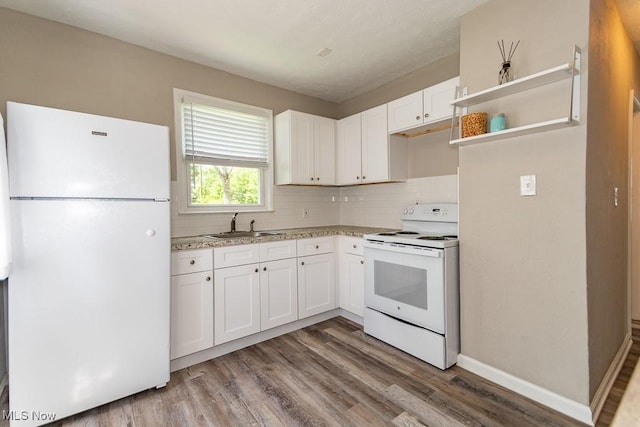 1620 S Taylor Rd, Cleveland Heights, OH 44118 - kitchen with white appliances, wood finished floors, a sink, tasteful backsplash, and white cabinetry