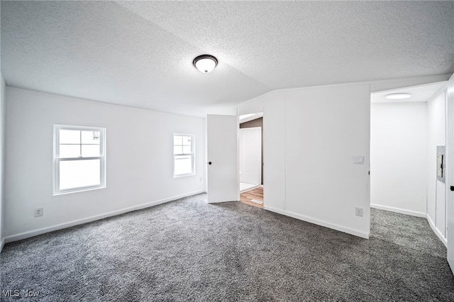 141 Marilyn Dr, Madison, OH 44057 - empty room featuring carpet floors, a textured ceiling, and baseboards