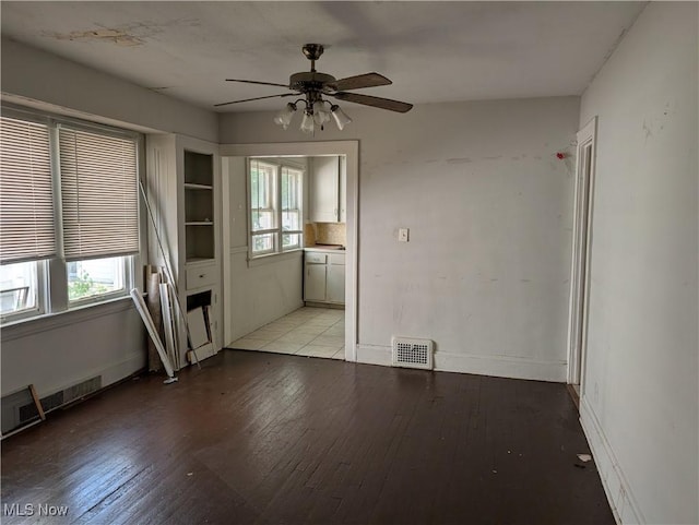 1367 Clearaire Rd, Cleveland, OH 44110 - spare room with light wood-type flooring, a ceiling fan, and baseboards