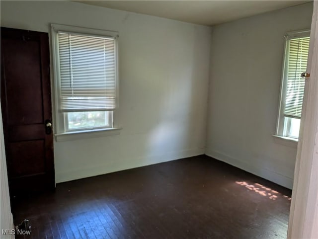 1367 Clearaire Rd, Cleveland, OH 44110 - empty room with dark wood-style flooring and baseboards