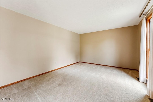 9852 Hocking St NW, Massillon, OH 44646 - spare room with light carpet and baseboards