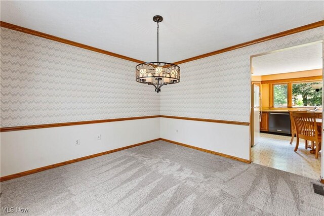 9852 Hocking St NW, Massillon, OH 44646 - empty room with baseboards, crown molding, light carpet, a chandelier, and wallpapered walls