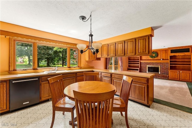 9852 Hocking St NW, Massillon, OH 44646 - kitchen with dishwasher, a peninsula, a sink, light countertops, and a chandelier