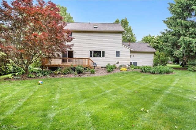9852 Hocking St NW, Massillon, OH 44646 - rear view of house featuring a deck and a lawn