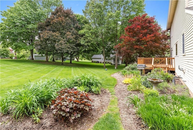 9852 Hocking St NW, Massillon, OH 44646 - view of green lawn featuring a wooden deck