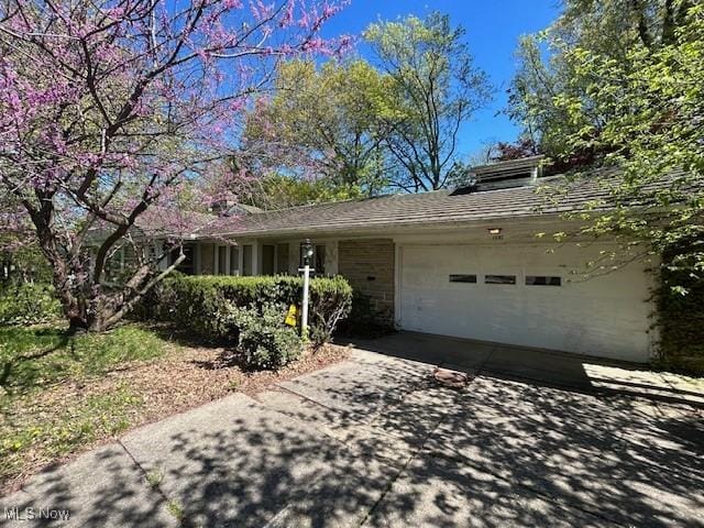 1081 Carver Rd, Cleveland Heights, OH 44112 - view of front of property with an attached garage and concrete driveway