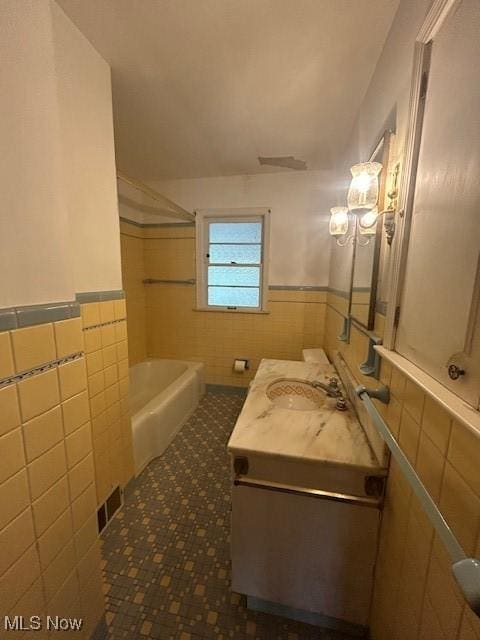 1081 Carver Rd, Cleveland Heights, OH 44112 - full bathroom with tile walls, wainscoting, vanity, tile patterned floors, and  shower combination