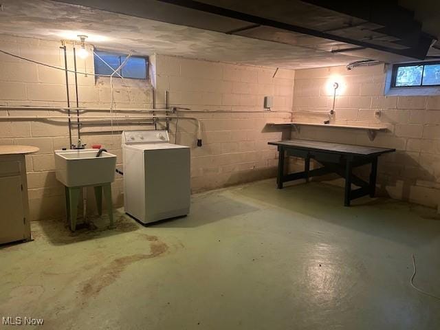 1081 Carver Rd, Cleveland Heights, OH 44112 - unfinished below grade area with a sink, concrete block wall, and separate washer and dryer