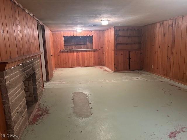 1081 Carver Rd, Cleveland Heights, OH 44112 - finished basement featuring wood walls and a brick fireplace