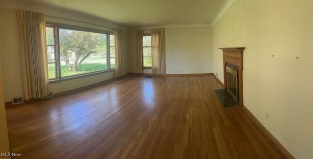 1081 Carver Rd, Cleveland Heights, OH 44112 - unfurnished living room featuring wood finished floors, a fireplace with flush hearth, and baseboards