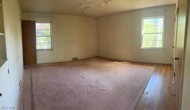 1081 Carver Rd, Cleveland Heights, OH 44112 - spare room with healthy amount of natural light and wood finished floors
