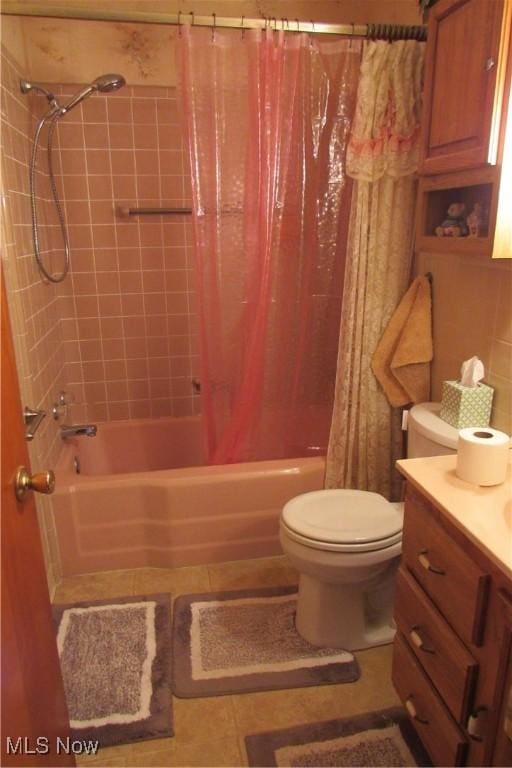 2313 W 13th St, Ashtabula, OH 44004 - bathroom with shower / bathtub combination with curtain, toilet, vanity, and tile patterned floors