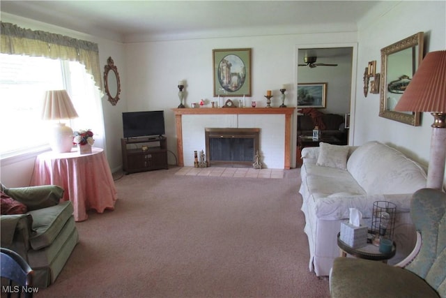 2313 W 13th St, Ashtabula, OH 44004 - living area featuring carpet floors, a ceiling fan, and a brick fireplace