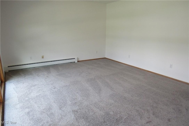 3318 Avon Blvd, Ashtabula, OH 44004 - carpeted empty room with a baseboard heating unit and baseboards