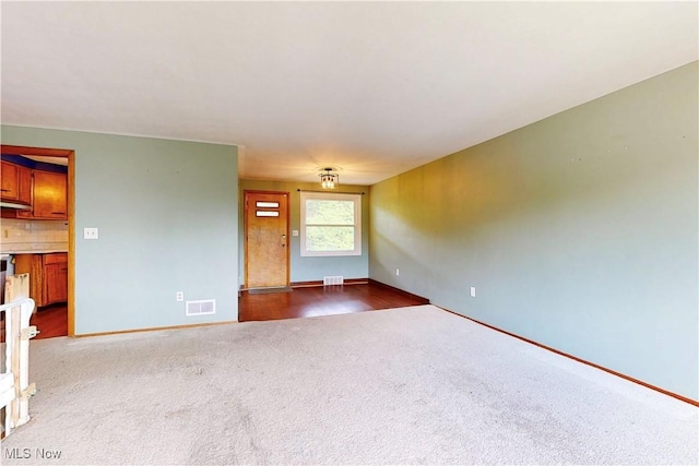 2920 Linda Way, Steubenville, OH 43952 - unfurnished living room with dark colored carpet and baseboards