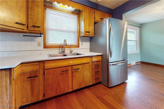 2920 Linda Way, Steubenville, OH 43952 - kitchen featuring a sink, freestanding refrigerator, dark wood finished floors, light countertops, and brown cabinetry