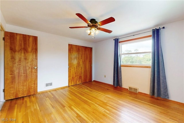 2920 Linda Way, Steubenville, OH 43952 - unfurnished bedroom with wood finished floors, baseboards, and ceiling fan