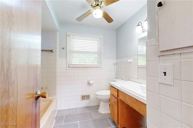 2920 Linda Way, Steubenville, OH 43952 - full bathroom with tile patterned flooring, vanity, a bathtub, toilet, and a ceiling fan