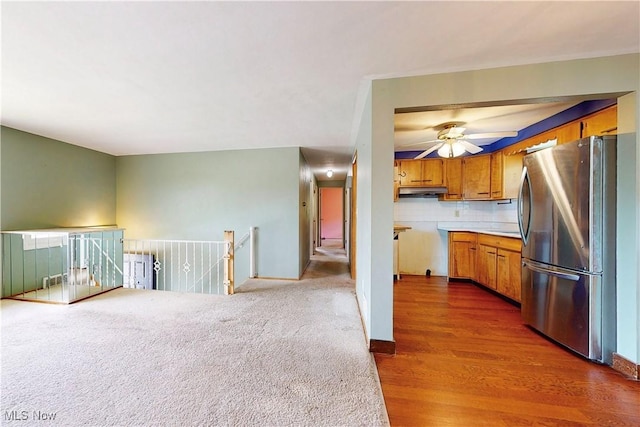 2920 Linda Way, Steubenville, OH 43952 - kitchen featuring freestanding refrigerator, brown cabinets, a ceiling fan, wood finished floors, and light countertops