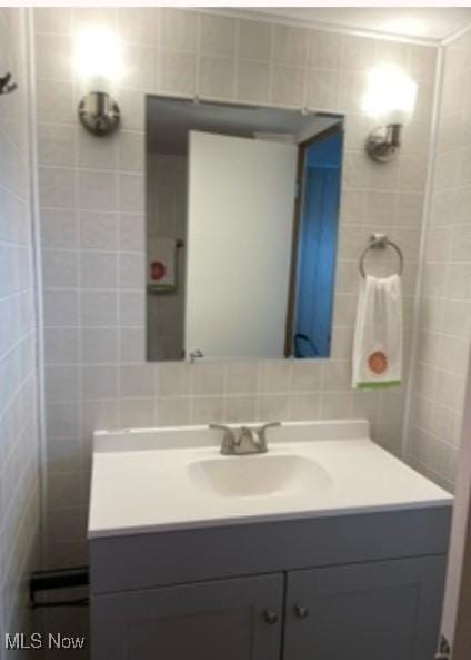 311 4th St, Beverly, OH 45714 - bathroom with tile walls and vanity
