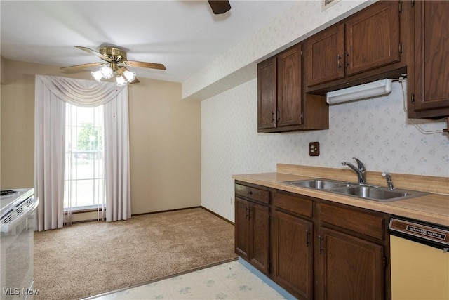 6533 Engle Rd, Brook Park, OH 44142 - kitchen featuring white appliances, a ceiling fan, a sink, light countertops, and wallpapered walls