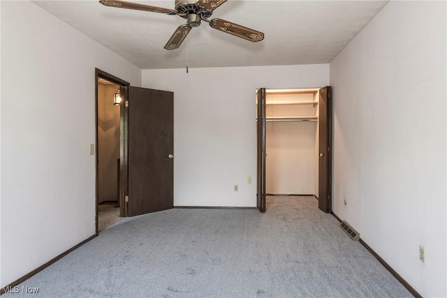 6533 Engle Rd, Brook Park, OH 44142 - unfurnished bedroom with carpet floors, ceiling fan, a walk in closet, and baseboards