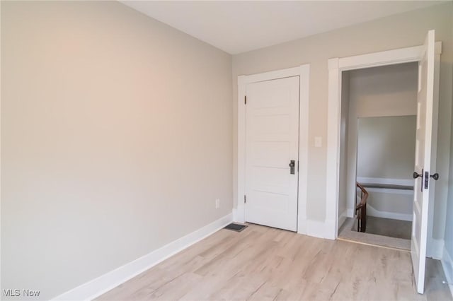 207 W Main St, Saint Clairsville, OH 43950 - unfurnished bedroom featuring light wood finished floors and baseboards