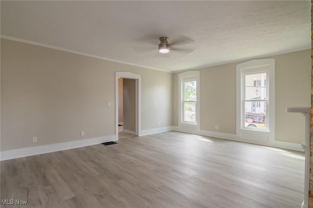 207 W Main St, Saint Clairsville, OH 43950 - spare room with a ceiling fan, wood finished floors, ornamental molding, and baseboards