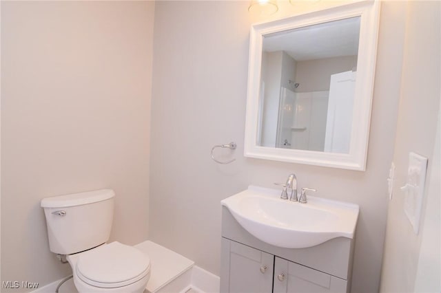 207 W Main St, Saint Clairsville, OH 43950 - full bath featuring vanity, toilet, a shower, and baseboards