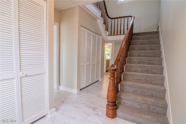 207 W Main St, Saint Clairsville, OH 43950 - staircase with marble look tiles and baseboards